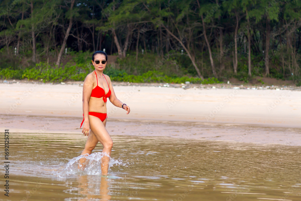 Fototapeta premium Woman in red bikini relax on beach