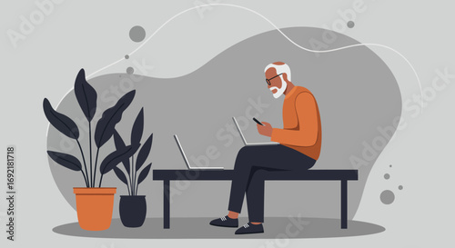 Elderly man expertly uses laptop and smartphone, embracing modern technology for work, learning, or staying connected in a minimalist indoor setting.
