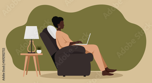 Woman working remotely on a laptop in a cozy recliner at home. Illustrates comfort, productivity, and modern work-life balance.