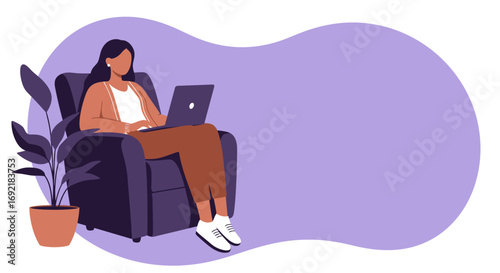 Woman comfortably working remotely from home on her laptop in an armchair. Ideal for concepts like freelance, online learning, and flexible work life balance.