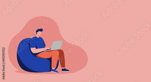 Focused man in a casual setting, comfortably working on a laptop from a bean bag. Ideal for concepts of remote work, freelancing, online learning, and flexible modern lifestyle.
