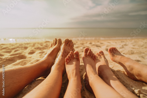 families feet on the beach
