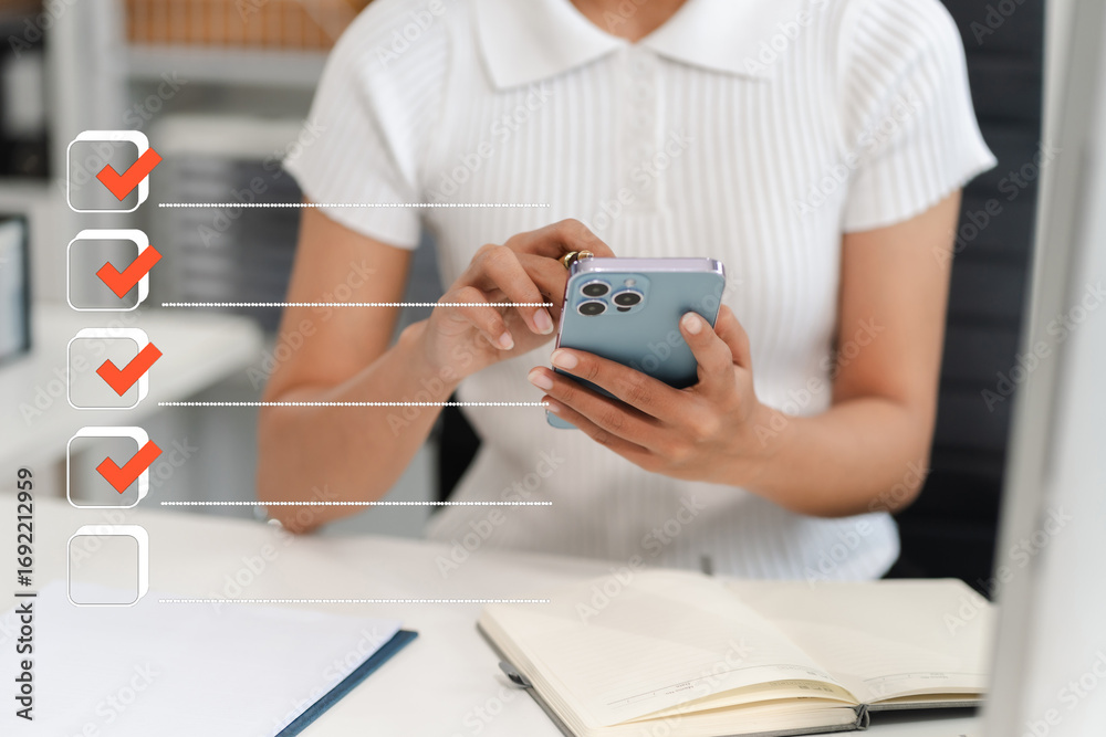 Fototapeta premium Business performance checklist concept, woman using tablet and laptop doing online checklist survey, filling out digital form checklist.