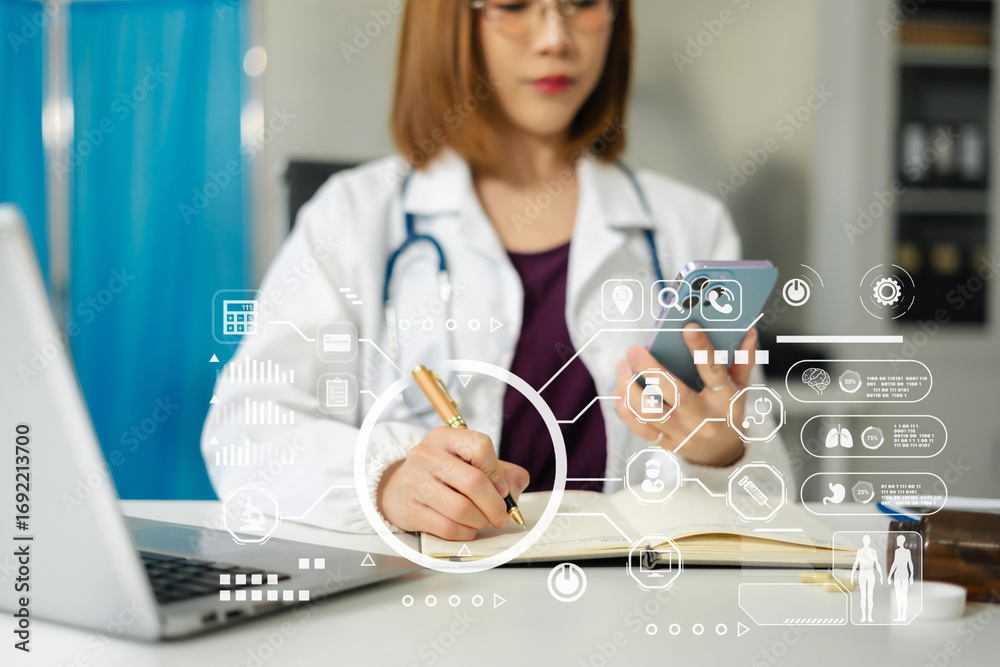 Fototapeta premium Doctor working on laptop and tablet and medical on clipboard on desk, electronics medical record system EMRs concept.