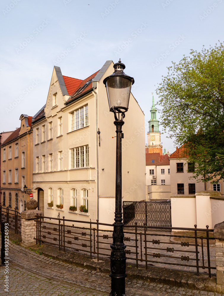 Obraz premium View of the Town Hall building on the main square in the old town of Poznan, Poland. Architecture of the historic city. Vertical photo.