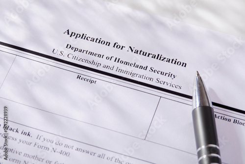 Close-up of pen on application for citizenship