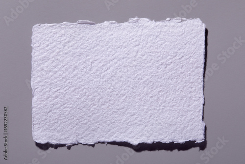 Torn paper on gray background