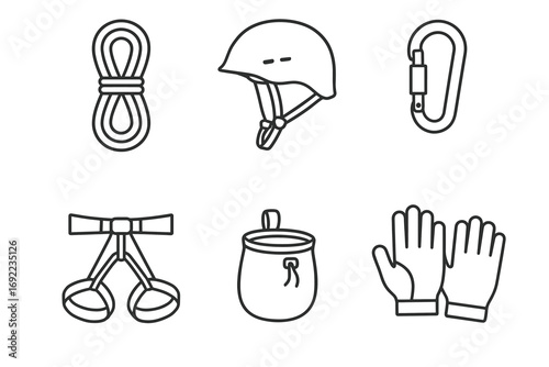 Essential rock climbing gear: rope, helmet, carabiner, harness, chalk bag, gloves