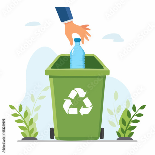 Hand Placing Plastic Bottle In Green Recycling Bin