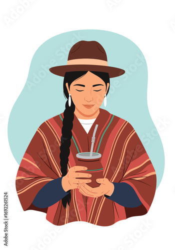Traditional south american woman wearing a poncho and hat enjoys a warm beverage in a gourd