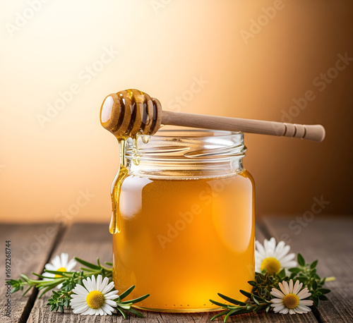 glass jar filled with a dipper and honey. eco-friendly, natural, and practical product. inherent deliciousness.