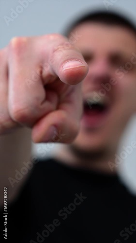 An angry and unfriendly laugh of a guy who points at someone and smiles.
Mocking laughter at a weakling.
Abuse and bullying among teenagers.
Teenager mocks classmate