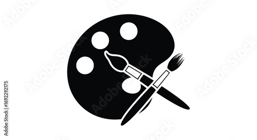 A black and white image of an art palette with paintbrushes crossed over it