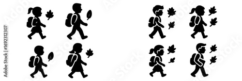 Diverse group of elementary school children with backpacks walking together among falling autumn leaves for the back to school season