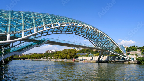 The modern Bridge of Peace spanning the Kura River in Old Town Tbilisi, Georgia