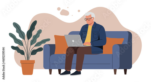 Senior man comfortably working from home on his laptop. Illustrates remote work, online learning, or digital leisure in a relaxed domestic setting.