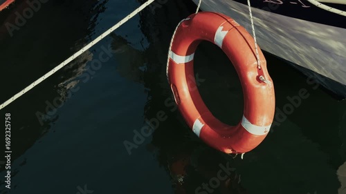 Life Buoy near the Boat on Sea Water