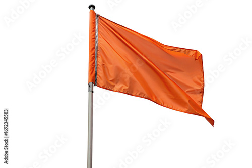 Bright orange flag waving in windy weather isolated on black background, perfect for design use
