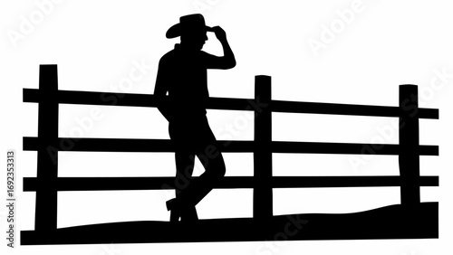 Silhouette of a cowboy leaning on a wooden fence while tipping his hat in a rural setting outdoors
