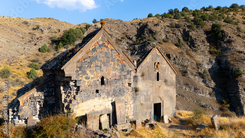 Quadro em tela An elevated view of two dilapidated stone Church nestled within a mountainous terrain