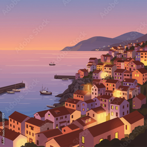 Charming Italian coastal village glows at twilight with boats at sea