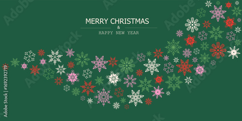 Christmas and New Year greeting card with colorful red, green, pink, and white snowflakes arranged in a flowing wave on a dark green background with festive typography