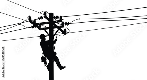 Silhouette of Utility Lineman Working on Power Pole with Safety Gear and Tools During Electrical Maintenance on Overhead Transmission Lines