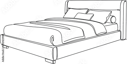 Clean, modern bed with neatly made linens and pillows, perfect for home decor inspiration.