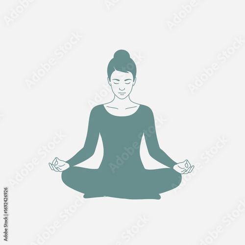 Woman meditating in a seated lotus pose against a light background.