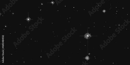 A vast expanse of the night sky filled with twinkling stars and distant galaxies in monochrome