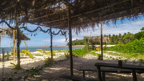 A rustic cabin by Castelhanos Beach offers the perfect spot to relax on Boipeba Island, Bahia, Brazil.