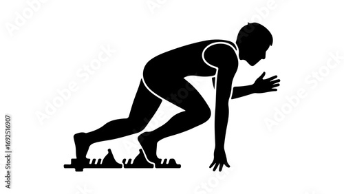 Silhouette of a sprinter at the starting blocks ready to run.