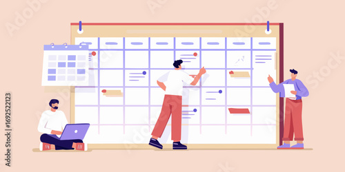 Team members collaborating and planning tasks on a large wall calendar for project management and scheduling