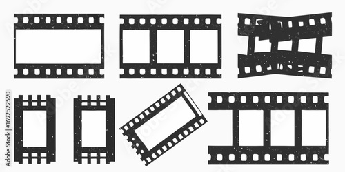 Collection of distressed black film strips and frames with empty white spaces for images or text