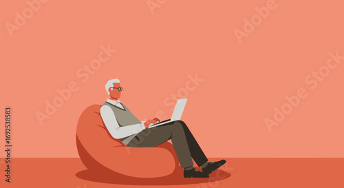 Senior man comfortably working or learning on a laptop while sitting on a bean bag chair at home. Modern retirement, digital literacy, and remote work concept.