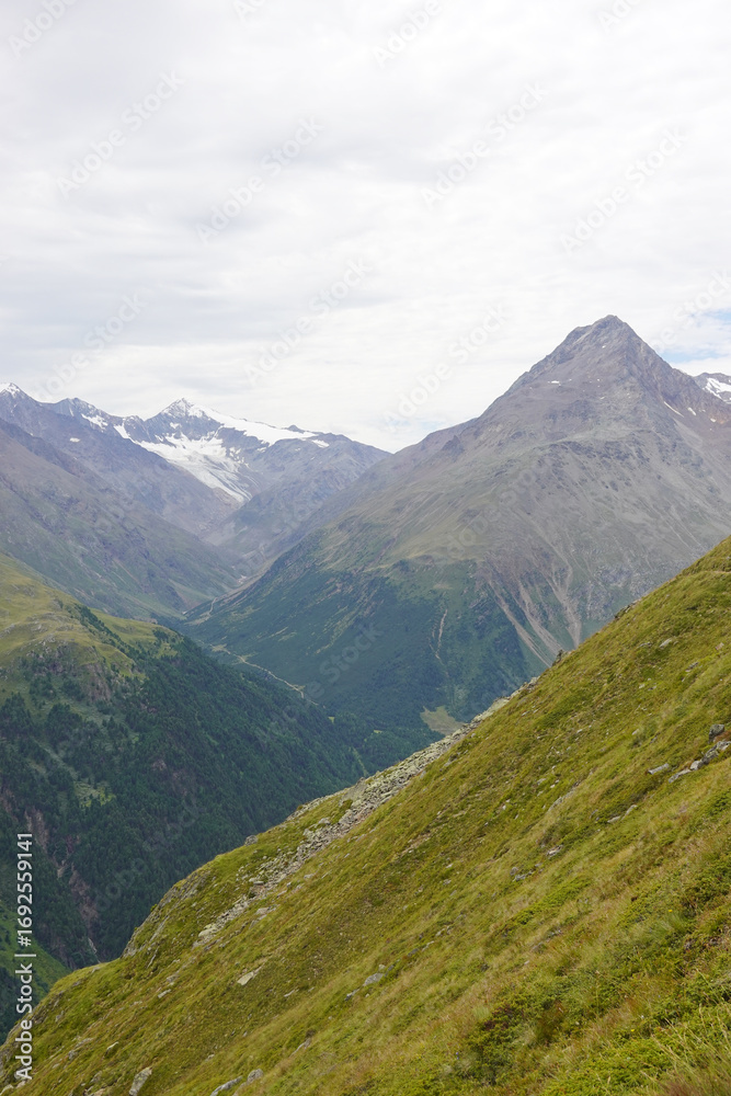 Fototapeta premium The view opening from the high hiking way from Tiefenbach glacier to Vent in Oetztal valley in the Austrian Alps 