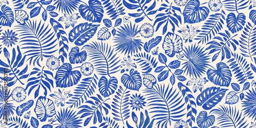 Seamless pattern of blue tropical leaves and flowers on a cream background