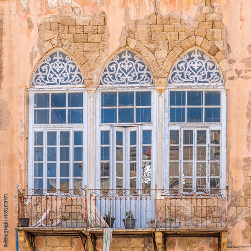 Interesting windows in Acre, Akko, Israel on a sunny day.
