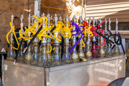 Hookah, Nargila pipes standing on the table of an outdoor cafe in in the walled city of Old Acre, Akko Israel.
