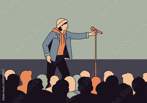 Person speaks into microphone on stage before audience.