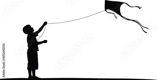 Joyful child silhouette flying a kite on a sunny day outdoors