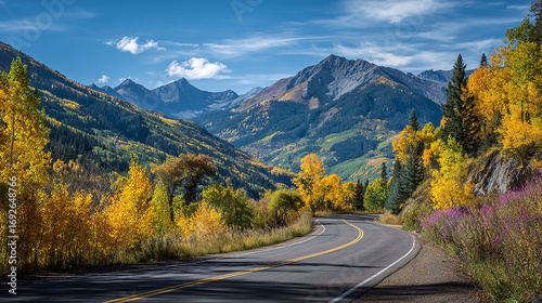 Curved Mountain Road Lined with Golden Aspen Trees in Autumn 