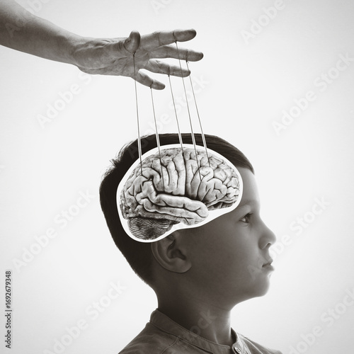 Canvastavla Image of a hand, that manipulates the mind of manipulates the mind of child