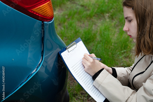 Insurance agent draws up documents after accident. Services of insurance companies concept