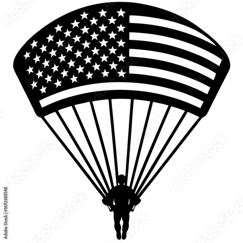 Skydiver descends under american flag parachute