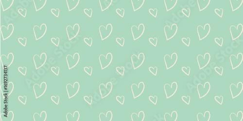 A charming seamless pattern featuring hand-drawn pastel hearts on a soft mint green background
