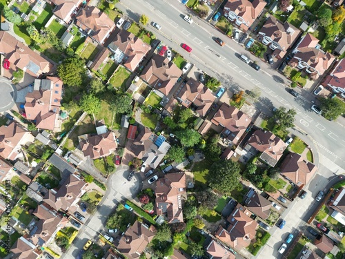 Aerial top down view looking onto buildings and neighbourhoods in Didsbury Manchester England. 