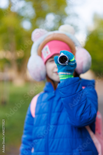 girl looking through binoculars