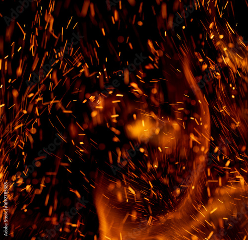 A fire with lots of sparks and smoke