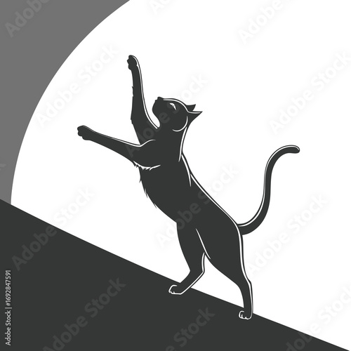 Elegant black silhouette of a cat gracefully stretching its body in a dynamic pose